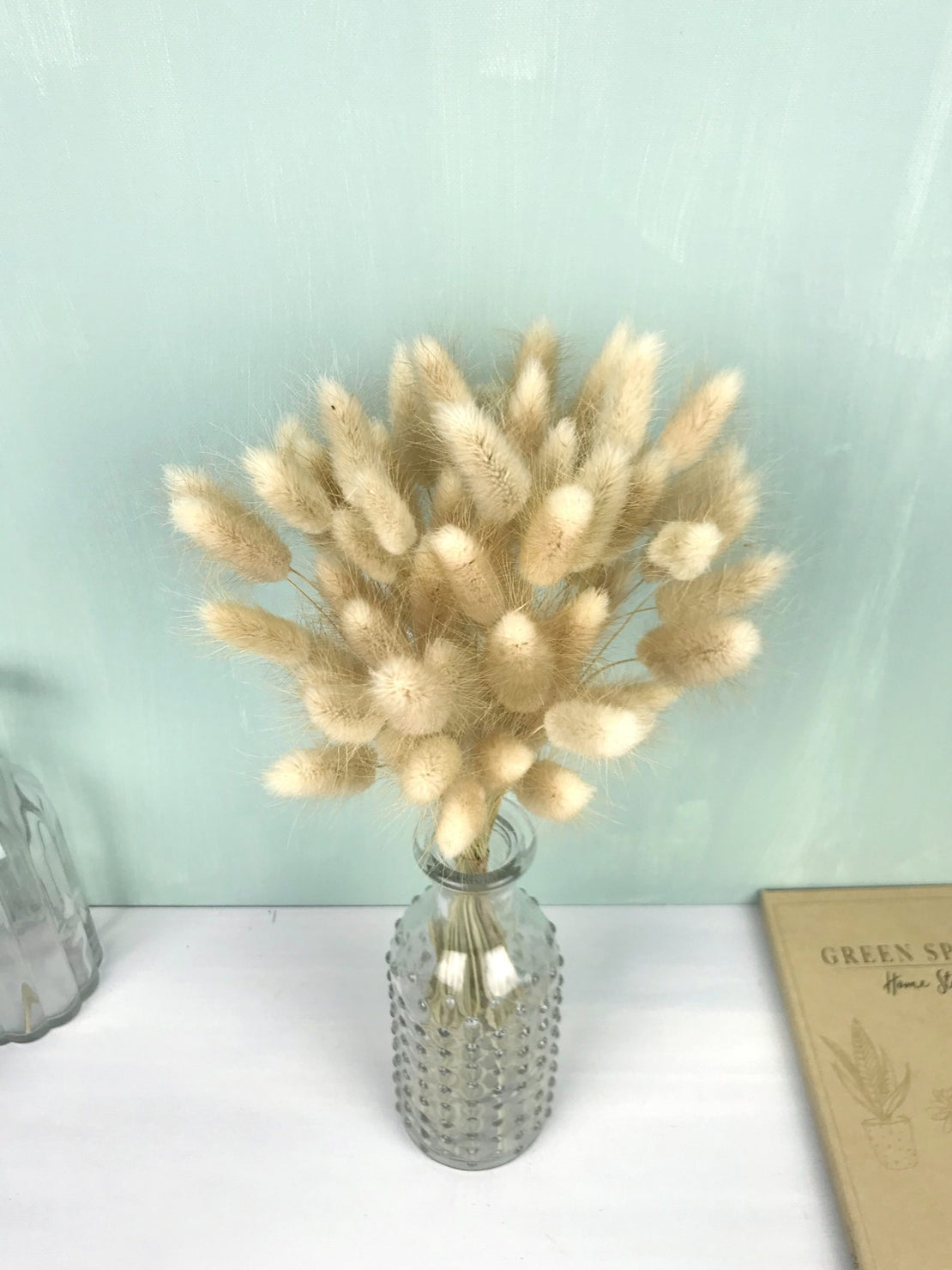 Small bouquet of dried natural lagurus, boho home decoration